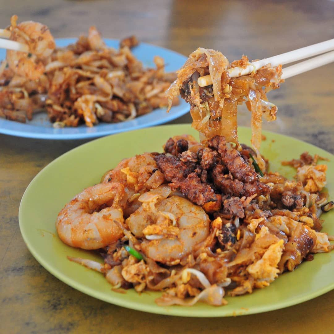 Ah Leng char koay teow with a fried duck egg on top, served on a white plate