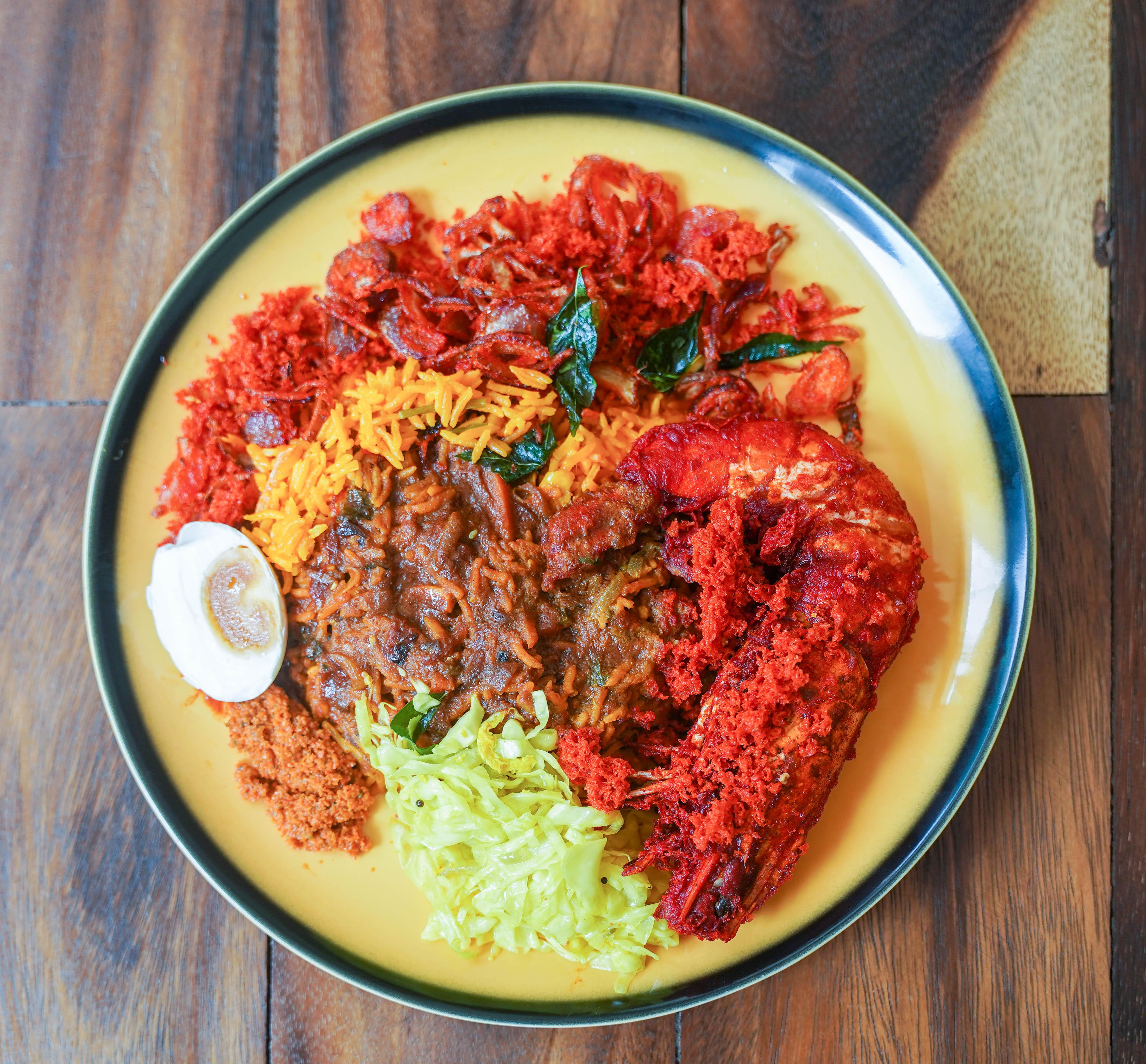 Nasi kandar plate with curry chicken and vegetables at Hameediyah